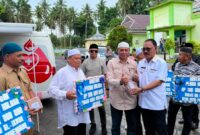 Bupati James Uang Menyerahkan Bantuan Pembangunan Rumah Ibadah